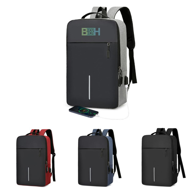 A laptop backpack in grey, featuring USB charging, with additional options in red, blue, and black. Includes a logo.