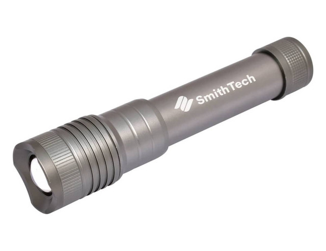 A gunmetal Vari-Beam torch with a textured grip and a branding logo.
