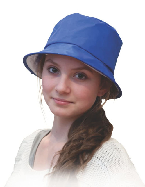 A blue bucket hat worn by a young girl, featuring a logo on the side.