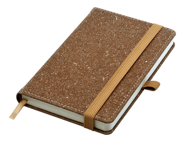 A brown bonded leather A6 notebook with an elastic band and a ribbon bookmark. It has a textured surface.