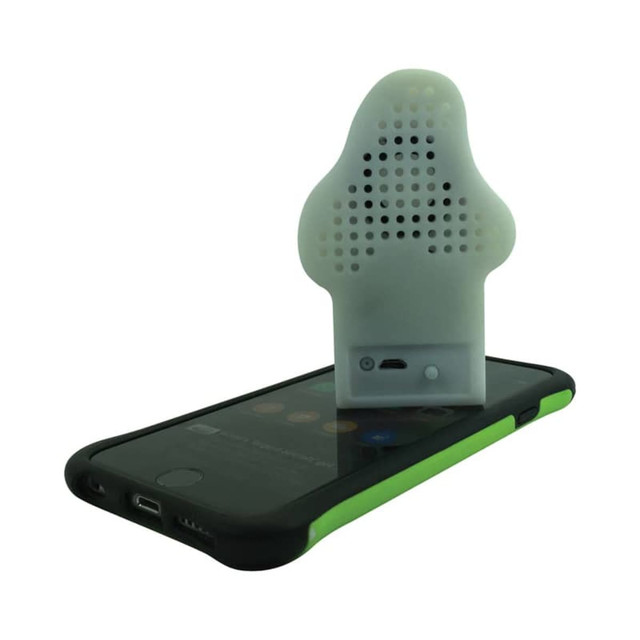 A white custom moulded Bluetooth speaker rests on a smartphone, featuring a unique design and a logo.