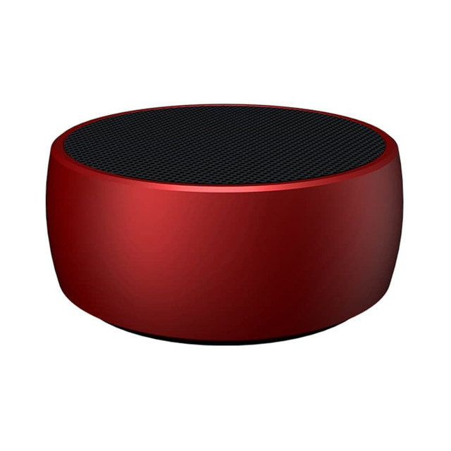 A round red wireless speaker with a black mesh top and a smooth finish, featuring a logo on the side.