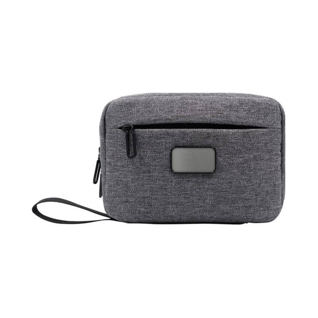 A grey toiletry bag with a zippered compartment, featuring a front pocket and a carrying strap. It has a logo.