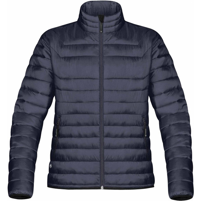A women's puffy jacket in navy blue with a high collar and zippered pockets, featuring a logo on the side.