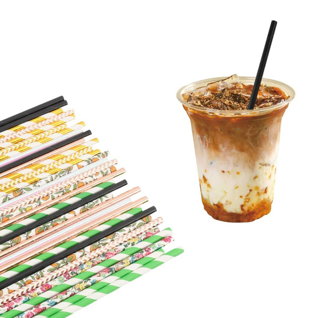 A collection of colourful 3-ply paper straws in various patterns alongside a drink with ice and cream.