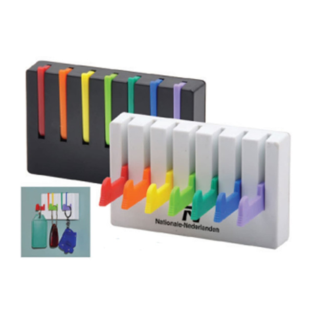A set of colourful keyrings in a white and black holder, featuring various vibrant hues including red, blue, and green.