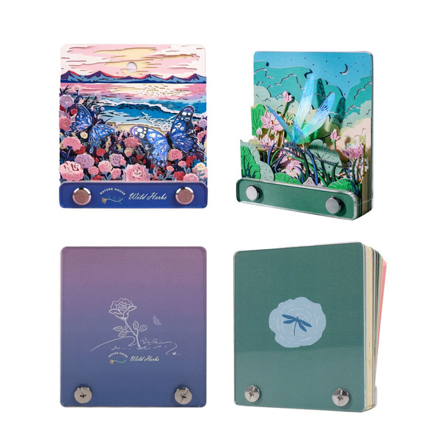 A decorative 3D paper-cut sculpture notepad in various colours featuring floral and butterfly designs. It has a hanging loop.