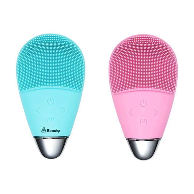 A silicone facial cleansing brush in turquoise and pink, featuring a silver base and buttons for operation.