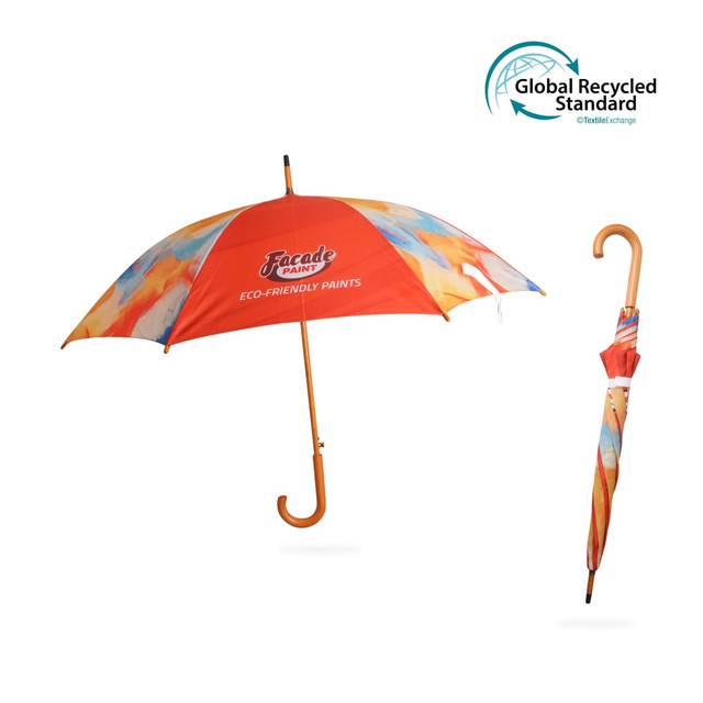 An eco-friendly umbrella in vibrant orange with a curved wooden handle, featuring a colourful abstract design.