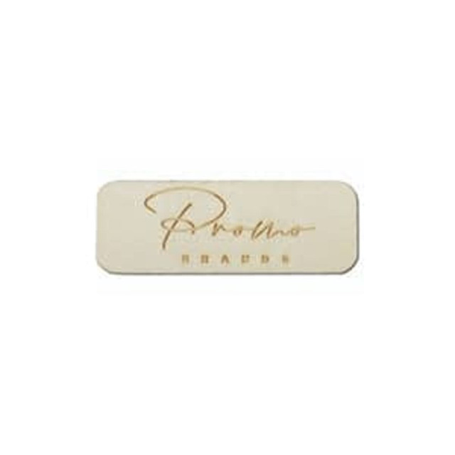 A rectangular wooden badge in light tan with a name engraved on the surface, featuring a subtle, polished finish.