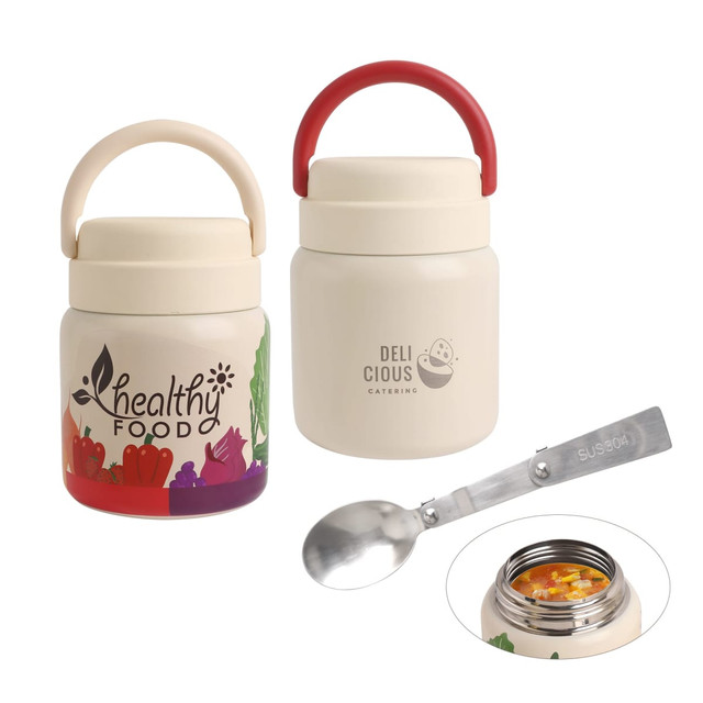 A stainless steel vacuum insulated food jar in cream with a red handle and a spoon, featuring branding on the side.