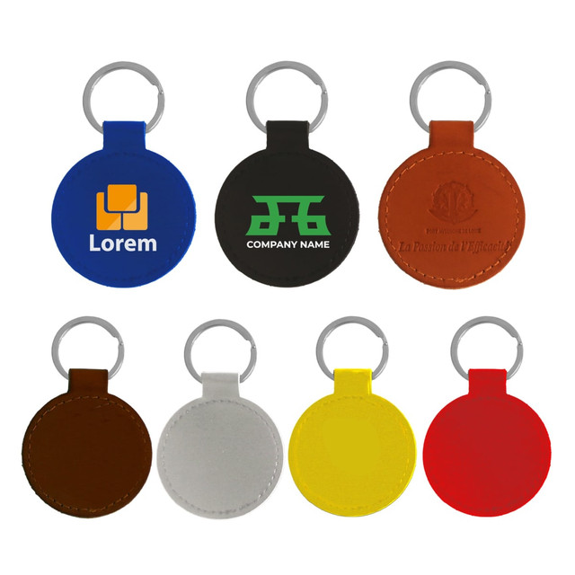 A selection of classic PU leather keyrings in blue, black, brown, grey, red, yellow, and orange, featuring various logos.