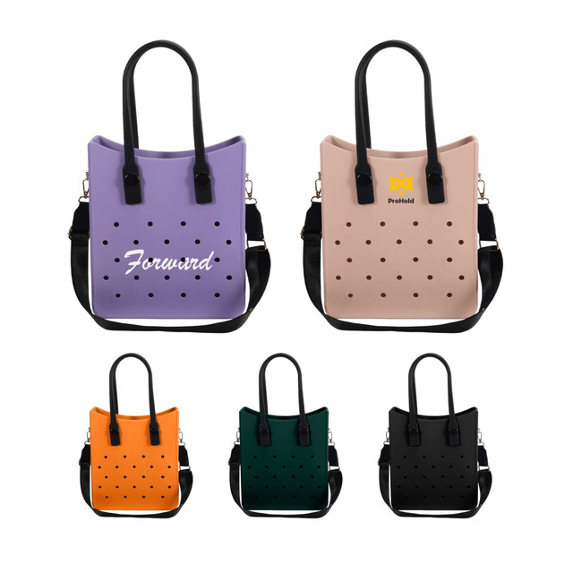 A collection of EVA Holes Tote Bags in lavender, blush, orange, dark green, and black, featuring black handles and branding.