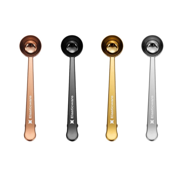 Coffee measuring spoons in copper, black, gold, and silver, with clips and a logo on the handles.