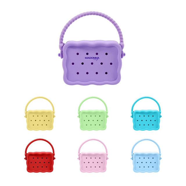 A collection of silicone bags in various colours, featuring a handle and multiple holes for ventilation.