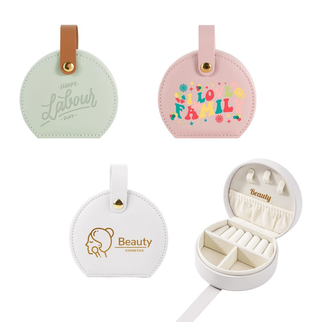 A small portable PU leather jewellery box in green, pink, and white with sections for organisation and a branding logo.