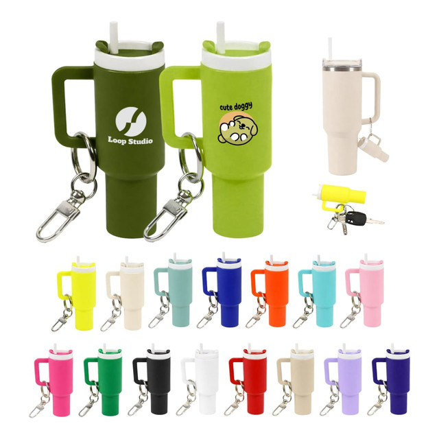 A drink bottle keyring in various colours, featuring a handle, straw, and a branding logo on some designs.
