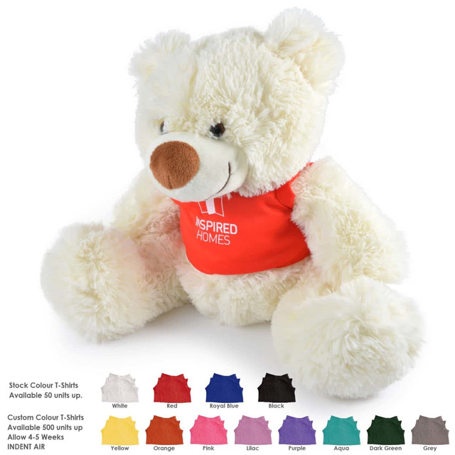 A plush teddy bear with a cream-colored body and a red shirt, featuring a sewn logo.