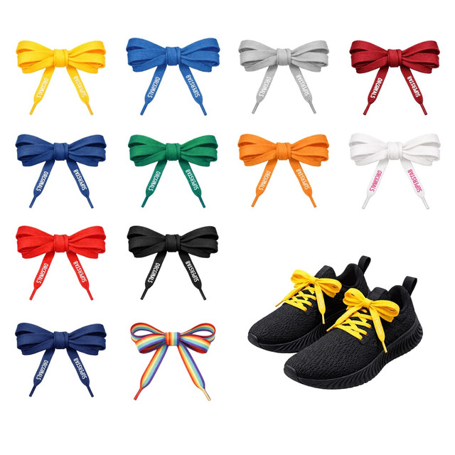 A collection of vibrant custom shoe laces in various colours, alongside a pair of black shoes with yellow laces.