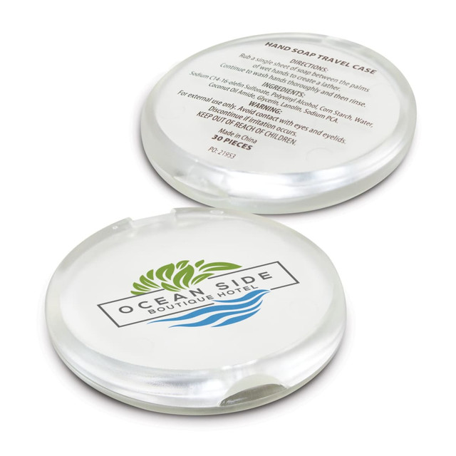 A round, clear travel case containing hand soap, featuring a logo design on the lid.