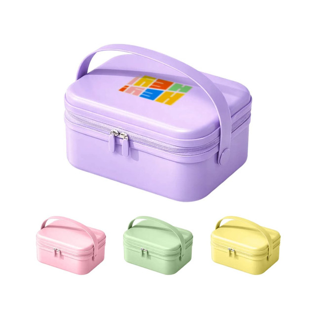 A portable mini suitcase in light purple with a handle, accompanied by pink, green, and yellow variants. Features a logo.