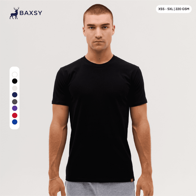 A plain black T-shirt displayed on a model, featuring a logo and available in various sizes.
