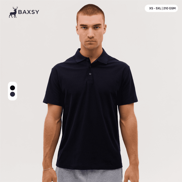 A navy blue polo shirt with a logo, featuring a classic collar and short sleeves, displayed on a model.
