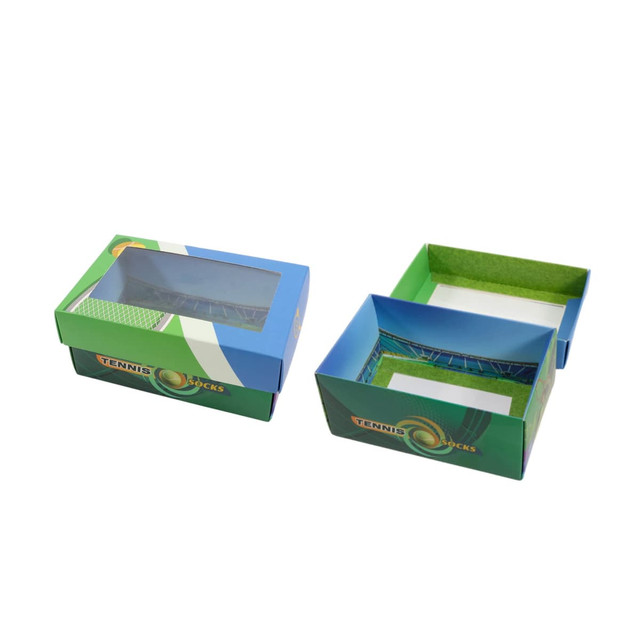 A custom gift box in blue and green with a windowed removable lid, featuring tennis-themed design elements.