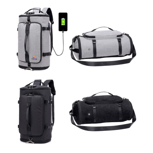 A grey and black convertible bucket backpack duffel bag with adjustable straps and a USB charging port.