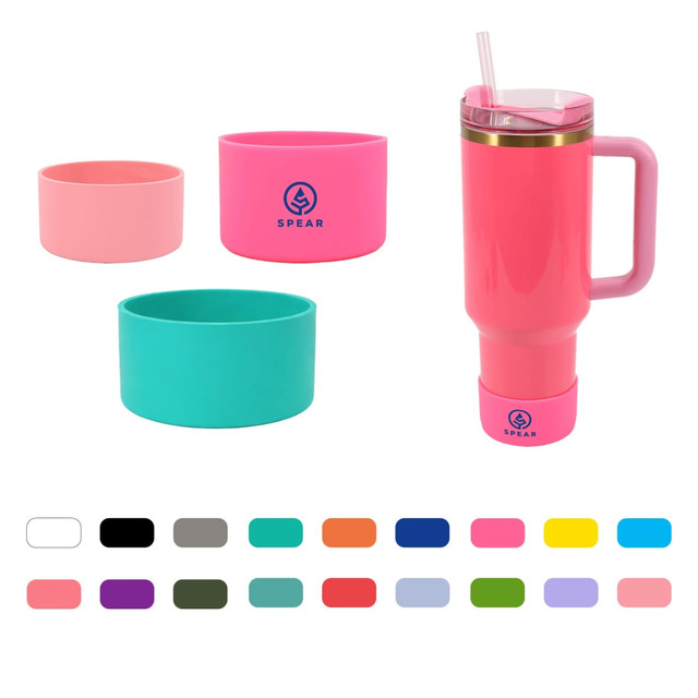 A drink bottle in pink with a handle, accompanied by silicone boots in pink, teal, and light pink. Features a logo.