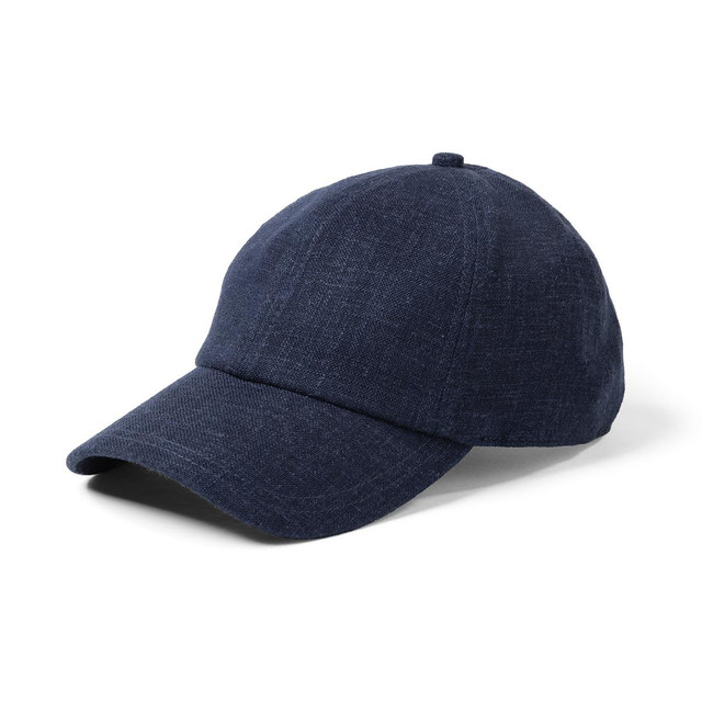 A navy blue linen cap with a curved brim and a structured crown, featuring a small logo.