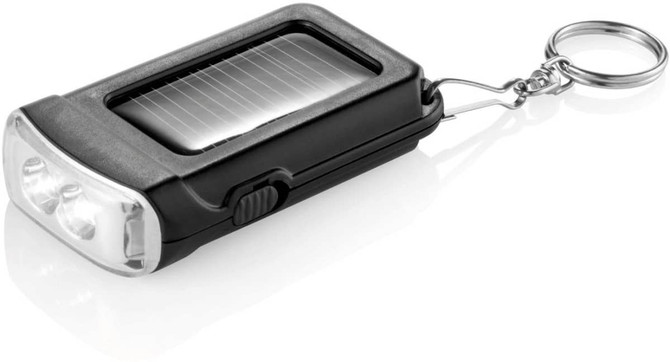 A black solar power torch keyring featuring a solar panel, flashlight, and a metal keychain attachment.