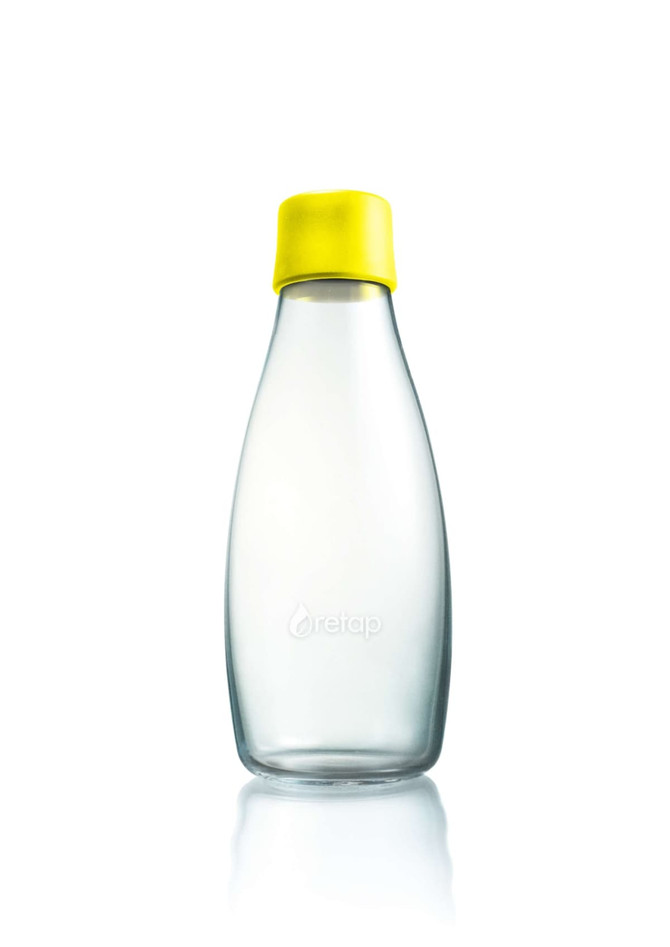A drink bottle made of glass with a transparent body and a bright yellow lid, featuring a logo on the front.