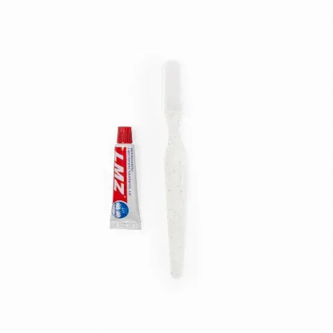 A white toothbrush and a small tube of toothpaste, both included in a dental kit. The kit has a logo.