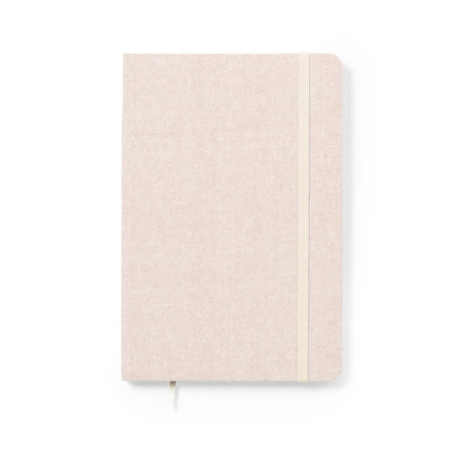 A notebook with a soft beige cover and an elastic closure. It features a textured finish and a ribbon bookmark.