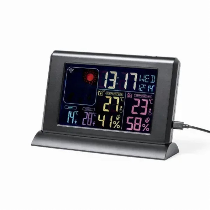 A digital weather station with a black frame, displaying time and indoor/outdoor temperature and humidity readings.
