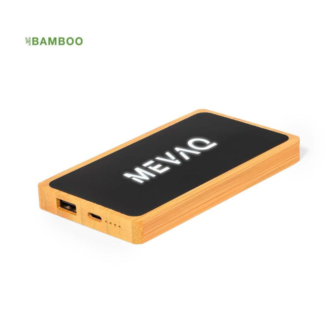 A bamboo power bank with a black surface, featuring a logo and multiple ports for charging devices.