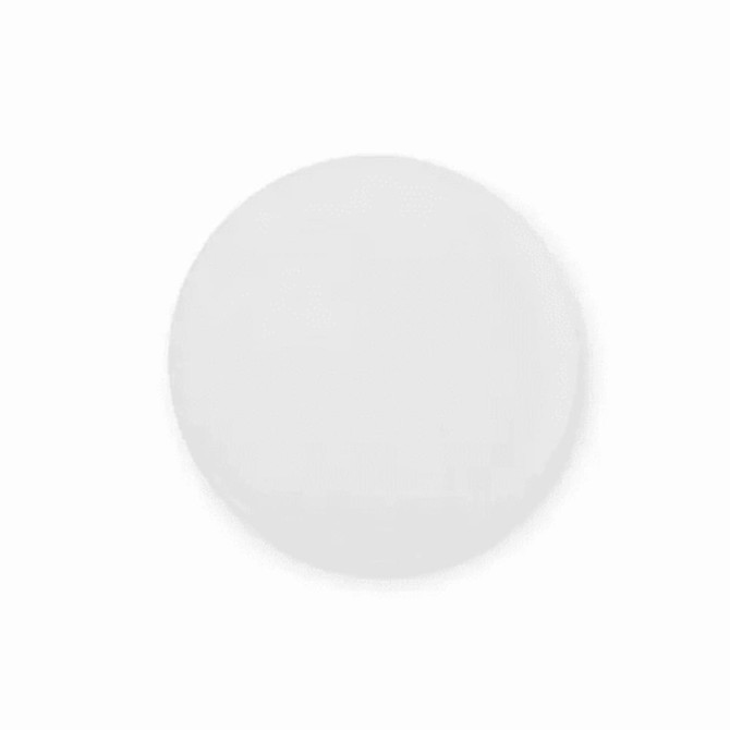 A round white button badge featuring a smooth surface and a backing for attachment.