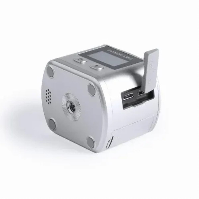A silver electronic device with a screen, USB-C port, and a slot for an insert. It features a logo on the side.