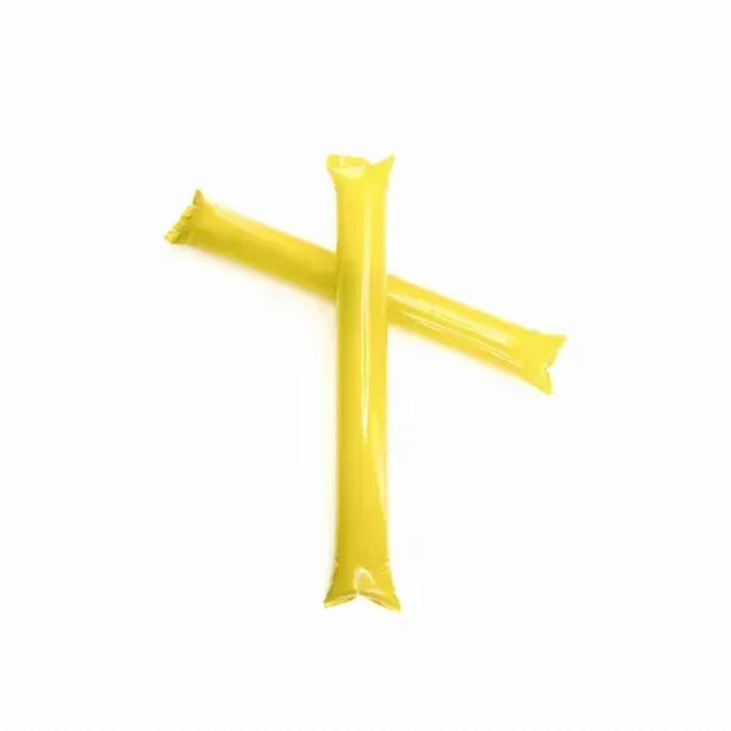 Two yellow novelty sticks crossed over each other, each with a clear, shiny wrapper.