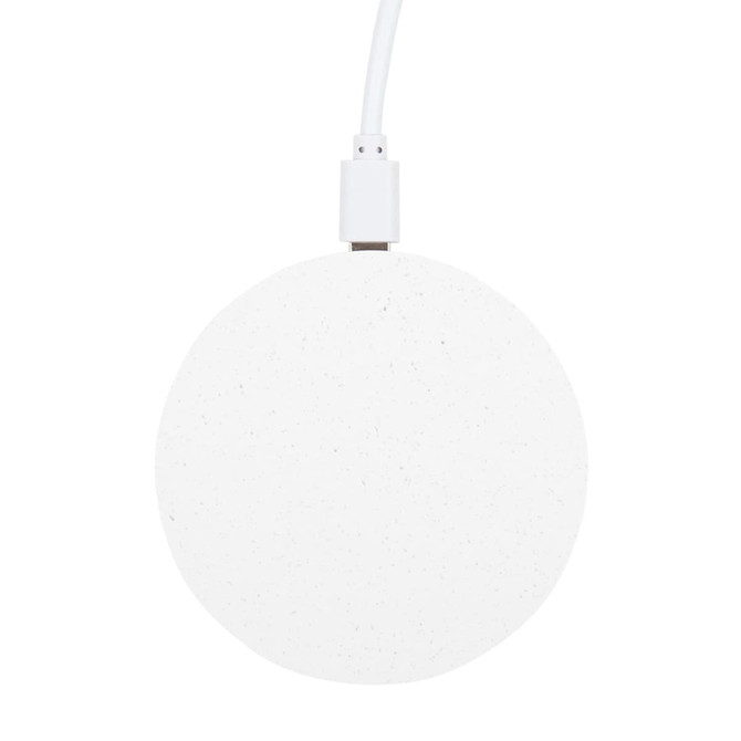 A round, white wireless charger with a textured surface and a connected charging cable.
