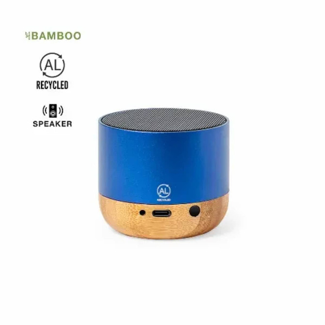 A blue speaker made from recycled aluminium and bamboo, featuring a circular shape and a textured top.
