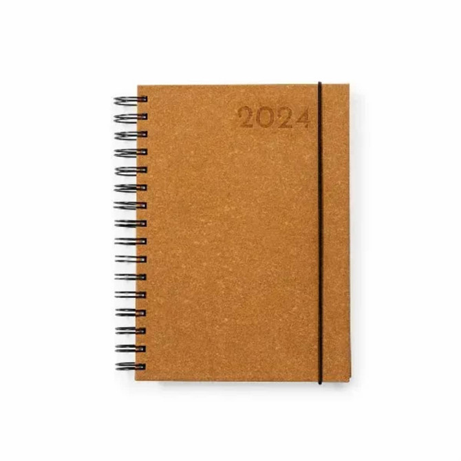 A brown spiral-bound diary with an elastic closure featuring the year 2024 embossed on the cover.