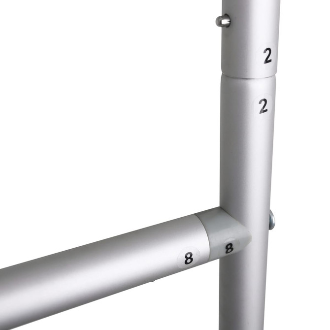 A metallic dispenser stand featuring silver pipes with numbered markings.