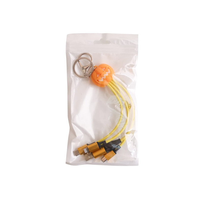 A yellow light-up charging cable with a keyring featuring a pumpkin-shaped design, packaged in a clear bag.