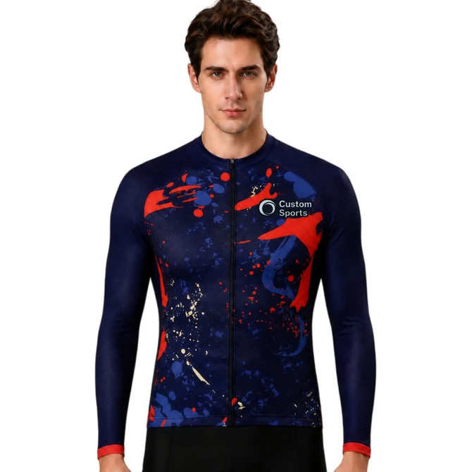 A men's long sleeve cycling jersey with a navy background, featuring red and abstract splatter designs, and a logo.