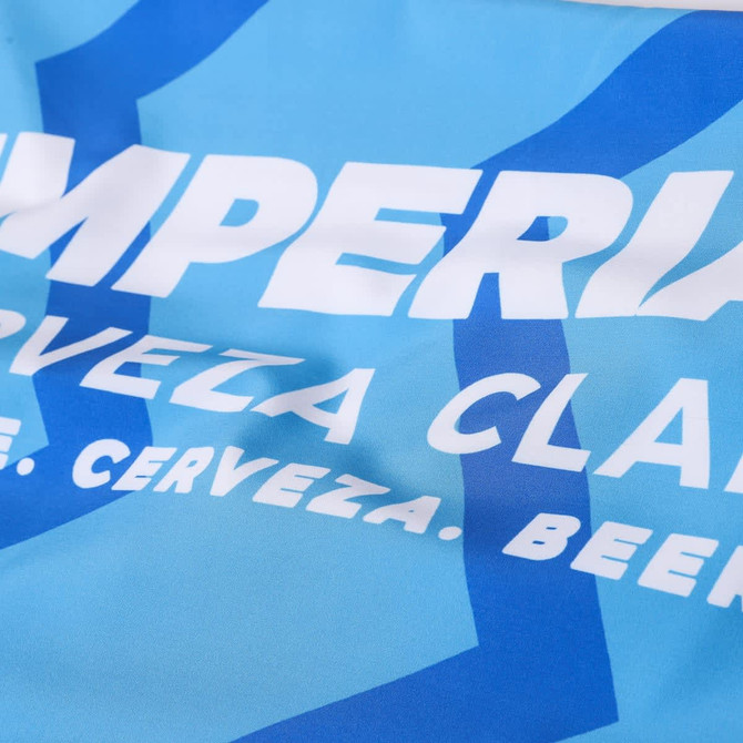 Light blue swim shorts made from polyester spandex, featuring a blue logo design.