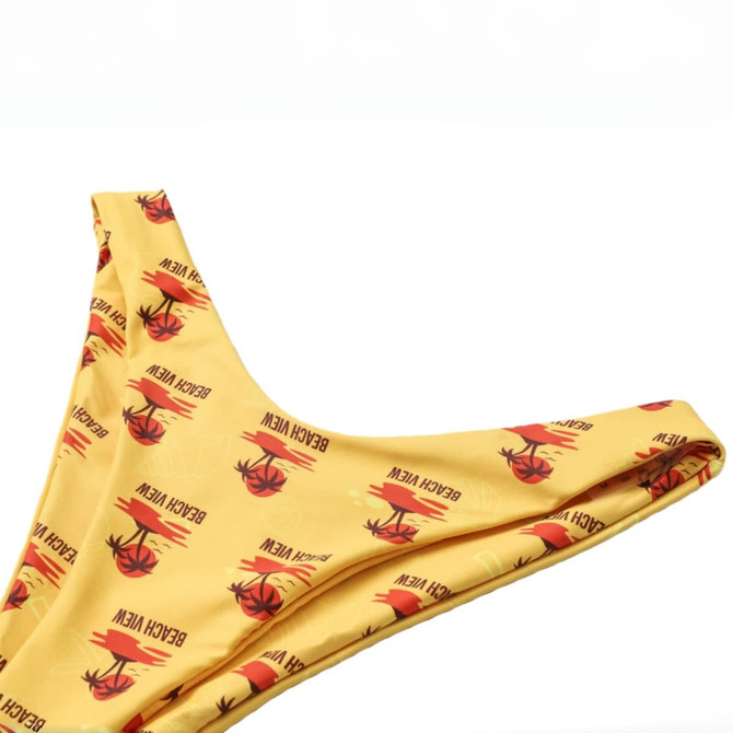A yellow bikini bottom featuring a repeating pattern, with a branded logo displayed prominently.