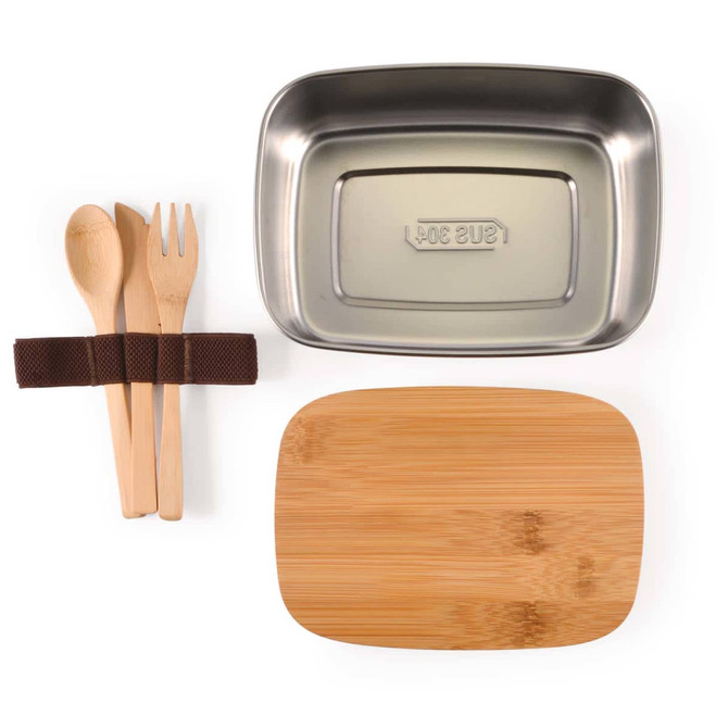 A stainless steel lunch box in silver with a bamboo lid, accompanied by wooden utensils and a fabric tie.