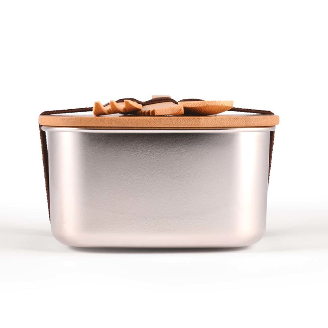 A silver lunch box with a tan leather strap and a smooth, metallic finish. It features a simple design and no visible branding.